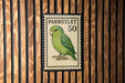 A postage stamp featuring a green parrot, with the number 50 printed on it.