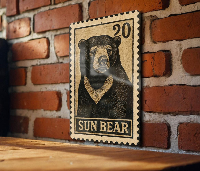 A wooden surface with a framed image of a black bear on it, mounted on a brick wall.