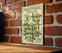 A vintage-style stamp featuring a plant with yellow flowers and green leaves, mounted on a brick wall.