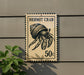 A sign featuring a hermit crab, with the text "HERMIT CRAB" and "50c" printed on it.