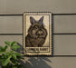 a lionhead rabbit on a sign, which is mounted on a wall.