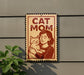 A sign that reads "CAT MOM" with an illustration of a woman holding a cat.