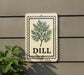 a sign with a plant illustration and the word "DILL" written on it, mounted on a wall.