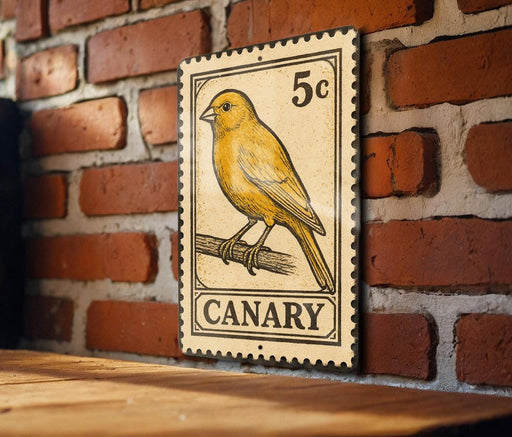 A vintage-style metal sign featuring a yellow canary perched on a branch, mounted on a brick wall.