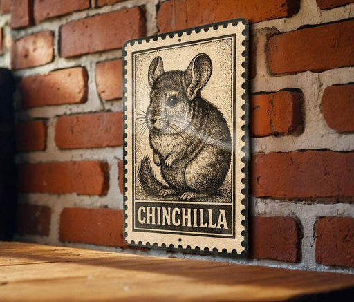 A metal sign featuring a chinchilla illustration is mounted on a brick wall.