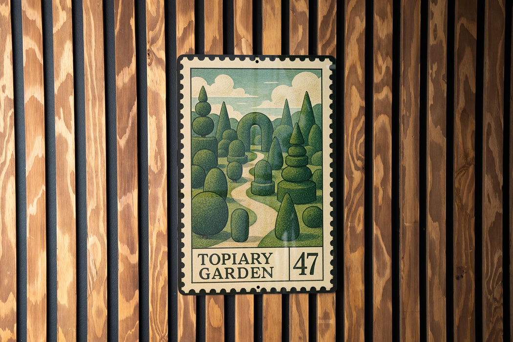 A framed illustration of a garden scene is displayed on a wooden wall, with a postage stamp-like design.