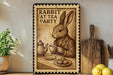 a wooden sign with a rabbit sitting at a table, holding a teacup and accompanied by a plate of food.