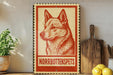 a red and white sign with a dog illustration, placed on a wooden surface next to a wooden cutting board and some lemons.