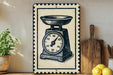 A vintage-style metal sign with a black and white illustration of a kitchen scale is displayed on a wooden shelf, accompanied by a wooden cutting board and a potted plant.