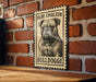 a bulldog, which is a breed of dog known for its distinctive appearance and muscular build.