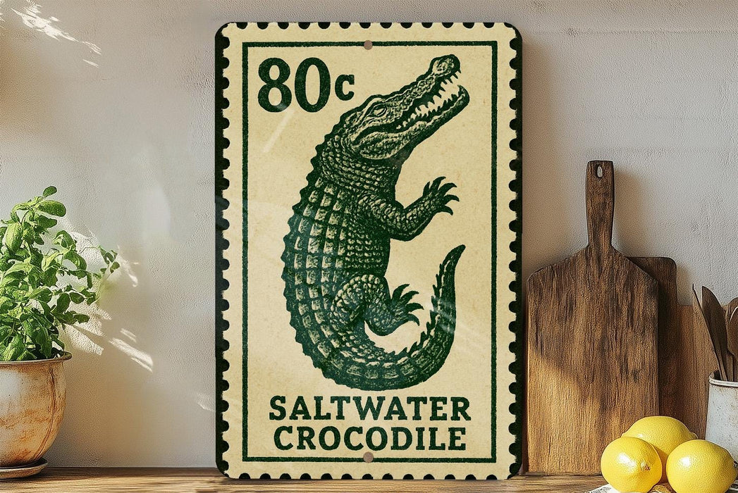 A framed poster of a saltwater crocodile is displayed on a wall, with a wooden cutting board and a potted plant to the side.