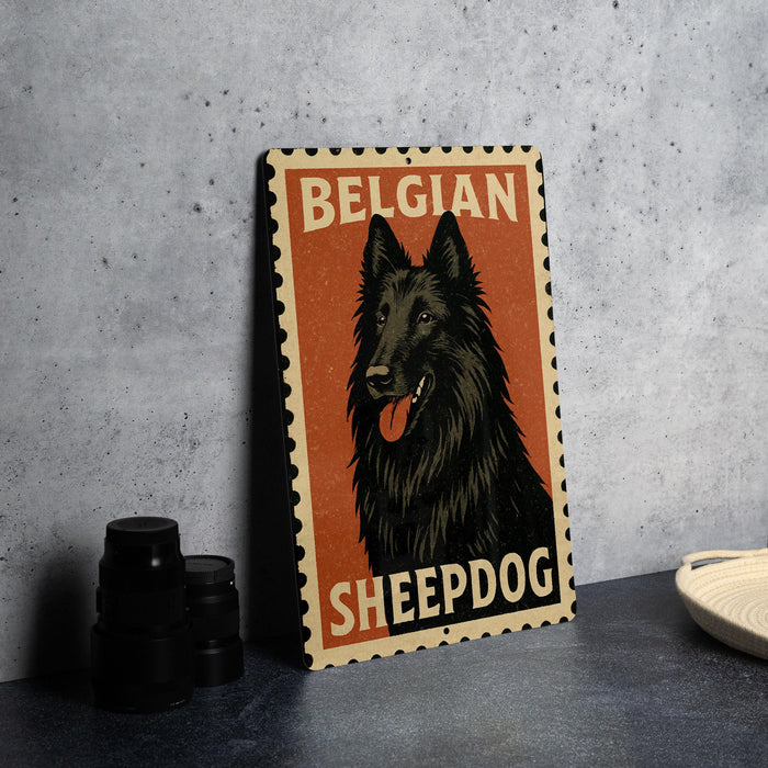 A metal sign featuring a black Belgian sheepdog with the text "BELGIAN SHEEPDOG" on it, placed on a countertop next to some black camera lenses.