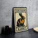 A metal sign with a rabbit illustration and the text "Harlequin Rabbit" on it, placed on a table next to some black objects.
