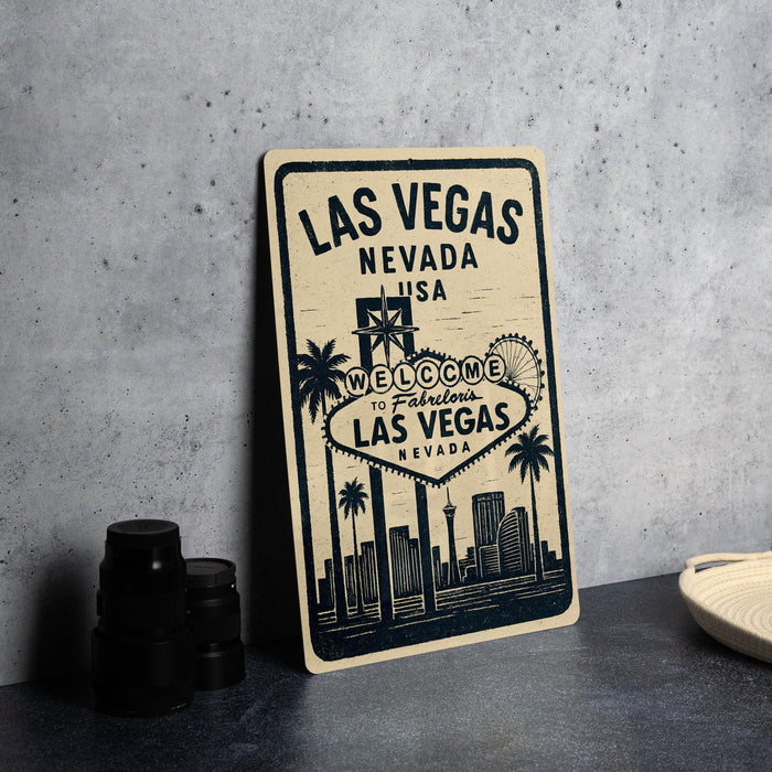 A vintage-style sign welcoming visitors to Las Vegas, Nevada, with a cityscape illustration and the text "Welcome to Las Vegas Nevada" on it.