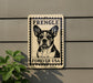 a sign with a dog's face on it, mounted on a wall.