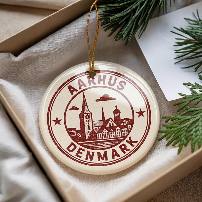 A decorative ornament with the text "AARHUS DENMARK" printed on it, hanging from a string.