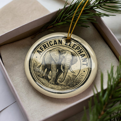 A decorative ornament in a box, featuring an illustration of an elephant.