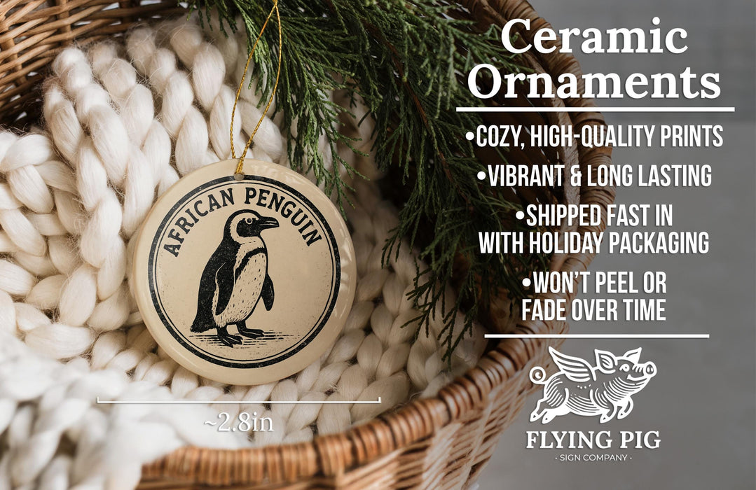 Ceramic ornaments featuring a penguin design, with a wicker basket and greenery in the background.