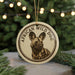 A circular ornament featuring a close-up image of a wild dog, with the text "African Wild Dog" around the edge.