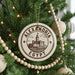A circular ornament on a Christmas tree, featuring a castle and the text "ALEXANDRIA EGYPT".