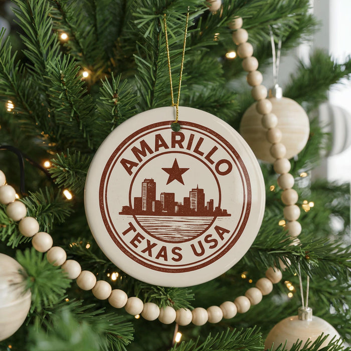 A Christmas tree decorated with ornaments, including a circular ornament with the text "AMARILLO TEXAS USA" and a star.