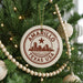 A Christmas tree decorated with ornaments, including a circular ornament with the text "AMARILLO TEXAS USA" and a star.