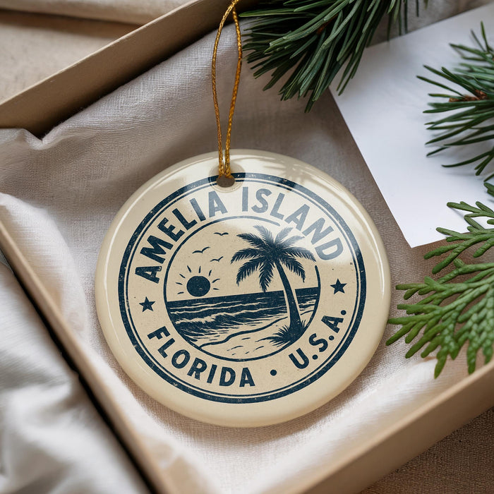A circular ornament with the text "AMELIA ISLAND FLORIDA U.S.A." printed on it, hanging from a string.