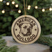 A circular ornament with the text "AMERICAN BULLDOG" and a graphic of a bulldog's head, hanging from a string.