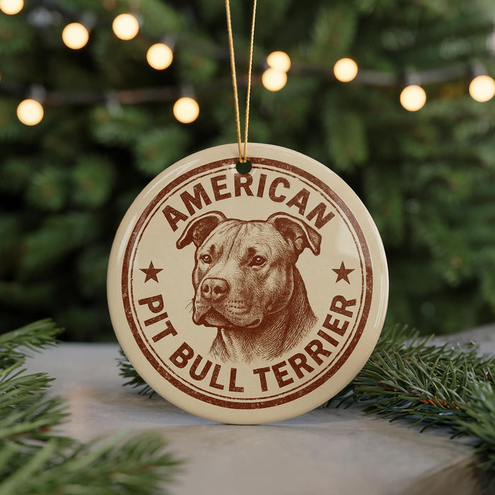 A circular ornament featuring an illustration of a pit bull terrier dog, with the text "AMERICAN PIT BULL TERRIER" printed on it.