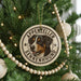 A Christmas tree decorated with ornaments, including a circular ornament with a dog's face and the text "Appenzeller Sennenhund".