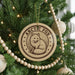 A Christmas tree decorated with ornaments, including a circular ornament with a fox illustration and the text "ARCTIC FOX".