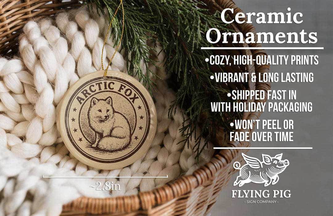 Ceramic ornaments, featuring a ceramic fox ornament with a pine tree branch, placed in a woven basket.