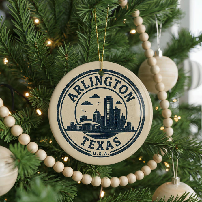 A circular ornament on a Christmas tree, featuring the text "ARLINGTON TEXAS U.S.A." and a graphic of a city skyline.