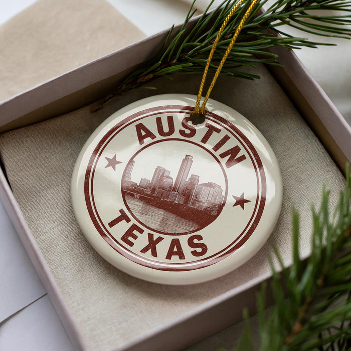 A circular ornament with the text "AUSTIN TEXAS" printed on it, surrounded by a border of stars.
