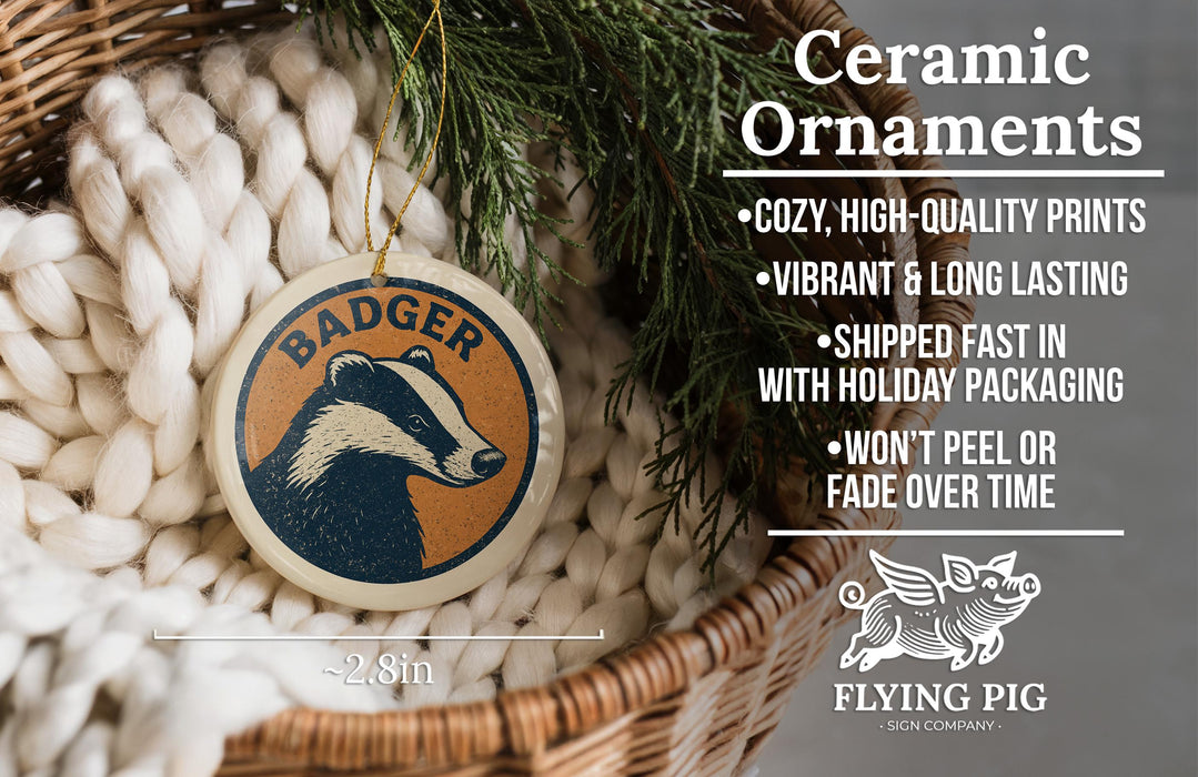 Ceramic ornaments featuring a badger design, with a wicker basket and greenery in the background.