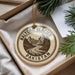 A circular ornament with the text "BALTORO GLACIER PAKISTAN" printed on it, surrounded by pine branches and a white paper.