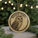 A round ornament featuring a barn owl design, with the text "Barn Owl" prominently displayed.
