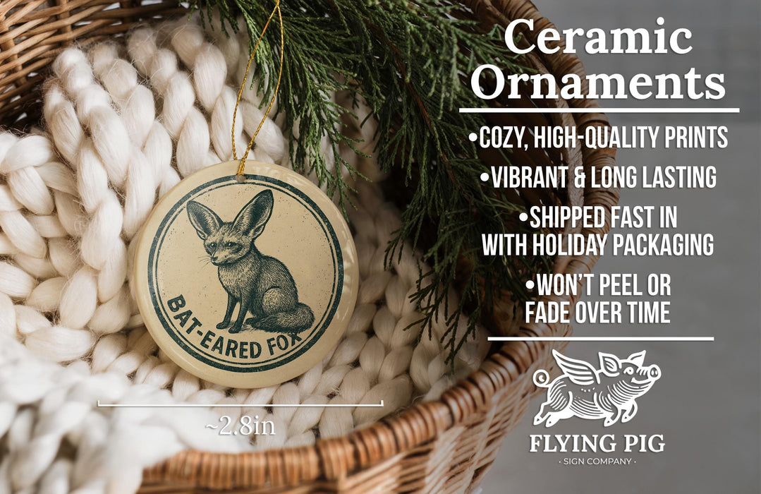 Ceramic ornaments, featuring a bat-eared fox design, are displayed in a wicker basket.