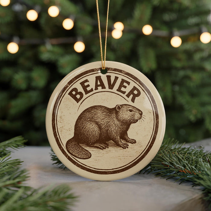 A circular ornament featuring a beaver illustration, with the word "BEAVER" written around the edge.