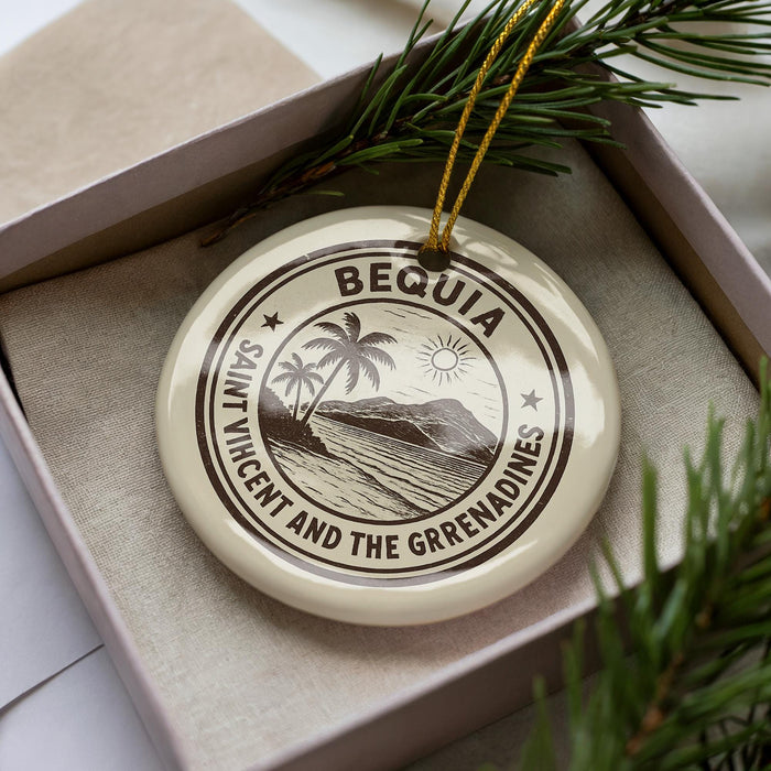 A circular ornament with the text "BEQUIA SAINT VINCENT AND THE GRENADINES" printed on it, surrounded by pine branches.