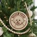 A Christmas tree decorated with ornaments, including a circular ornament with a dog's face and the text "BICHON FRISE" on it.