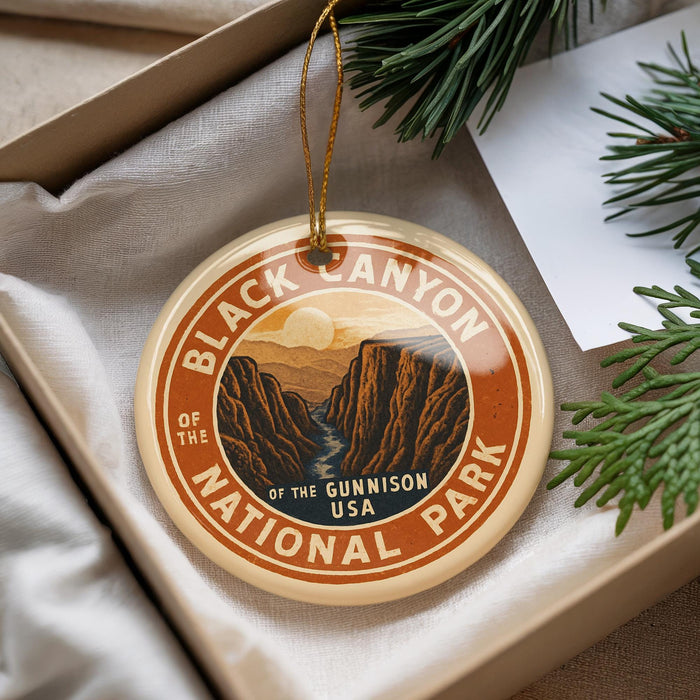 A circular ornament with the text "Black Canyon of the Gunnison National Park" and an illustration of the canyon, hanging from a string.