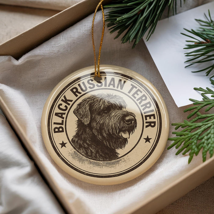 A circular ornament featuring a black and white illustration of a Russian Terrier dog, with the text "BLACK RUSSIAN TERRIER" printed on it.