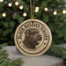A circular ornament featuring a black Russian terrier dog's head, with the text "BLACK RUSSIAN TERRIER" printed on it.