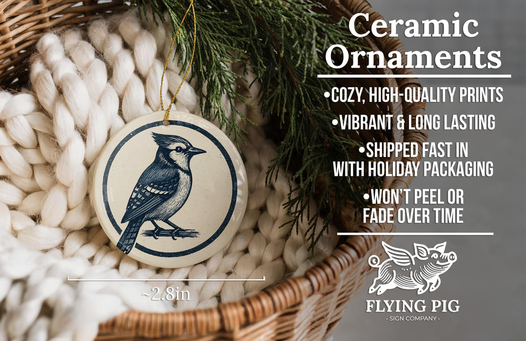 Ceramic ornaments, featuring a blue bird on a white background, are displayed in a wicker basket.