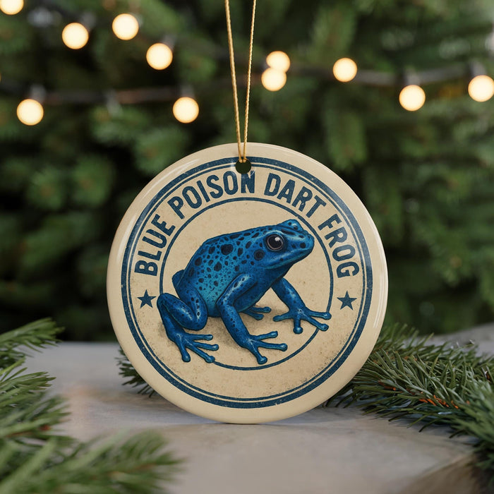 A blue poison dart frog ornament is displayed on a Christmas tree, with the text "BLUE POISON Dart Frog" visible on the ornament.