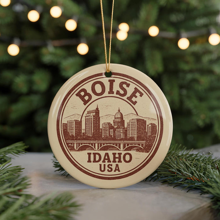 A circular ornament with the text "BOISE IDAHO USA" printed on it, featuring an illustration of Boise, Idaho, USA.