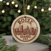 A circular ornament with the text "BOISE IDAHO USA" printed on it, featuring an illustration of Boise, Idaho, USA.