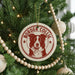 A Christmas tree decorated with ornaments, including a circular ornament with a Border Collie image and the text "BORDER COLLIE" printed on it.