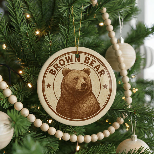 A Christmas tree decorated with ornaments, including a circular ornament with a brown bear image and the text "Brown Bear".